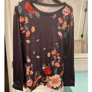 Stretchy polyester/spandex grayish black long sleeved shirt with flowers. 3x